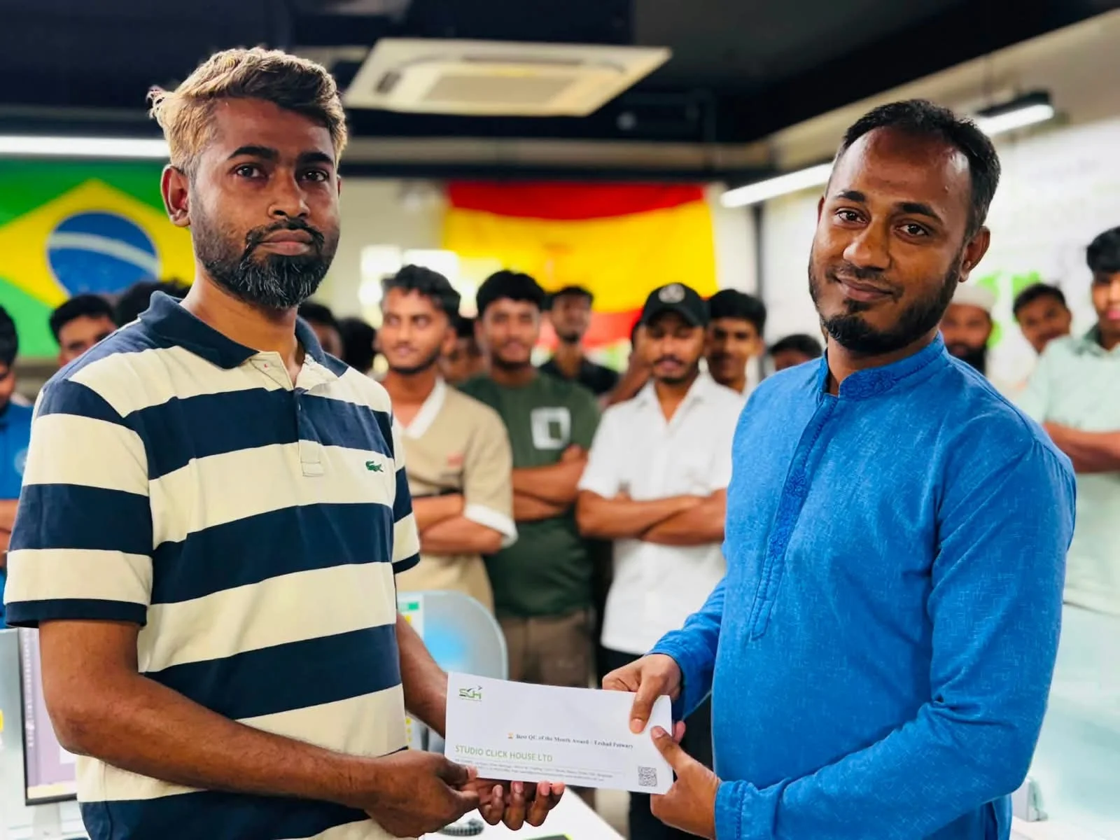 Studio Click House team member receiving monthly performance bonus and recognition award