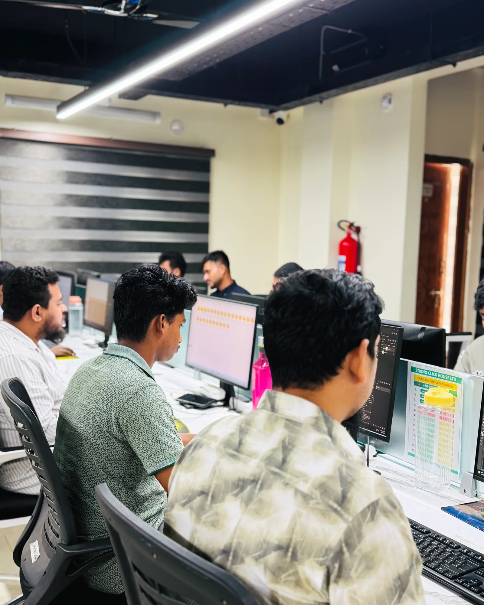 Image editors working at Studio Click House production desks