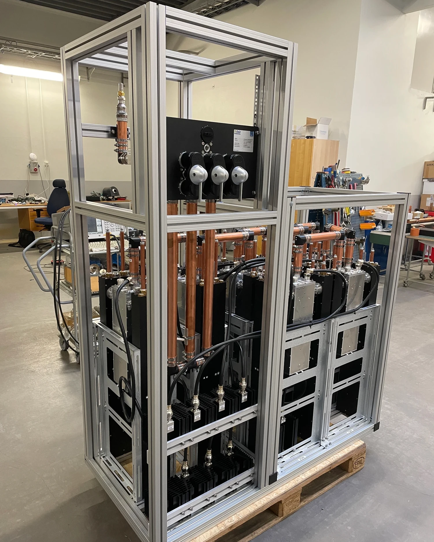 Raw industrial machinery server rack photographed in a workshop before clipping path