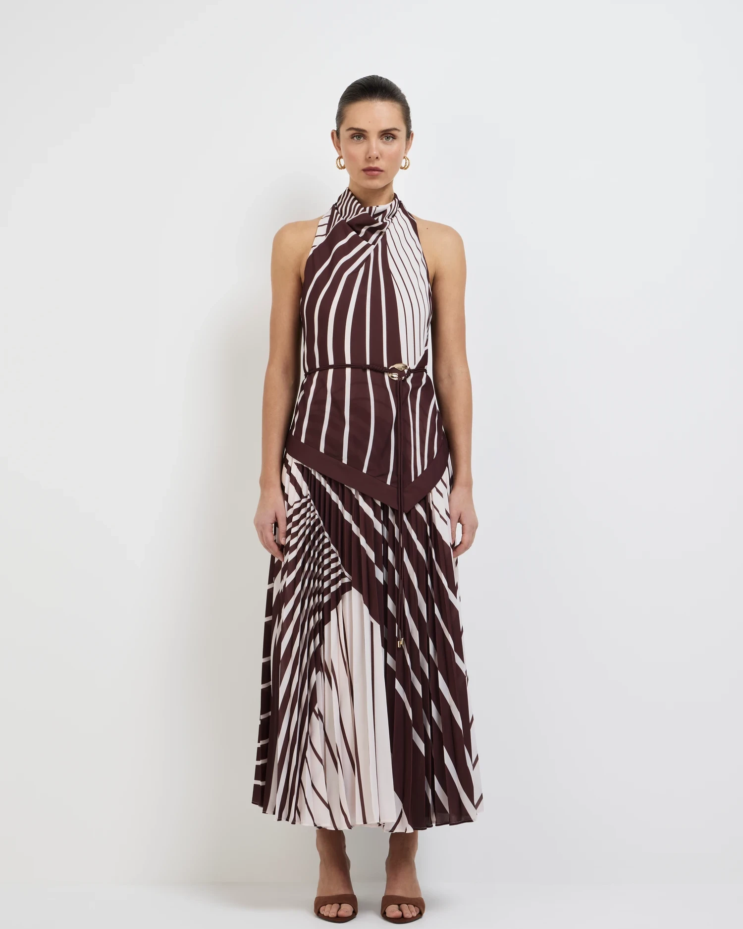 High fashion editorial model in designer pleated maxi dress