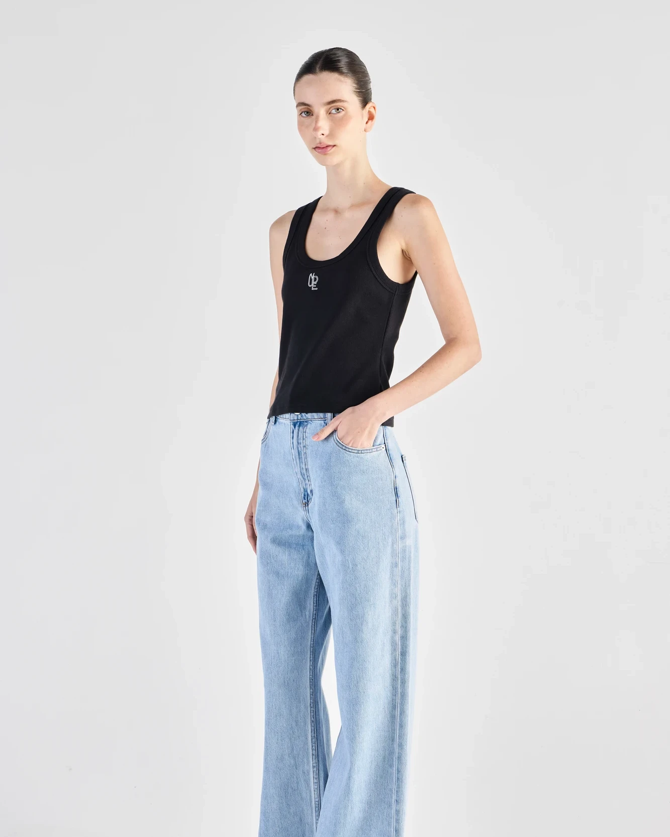 Fashion model wearing a denim outfit before e-commerce model retouching