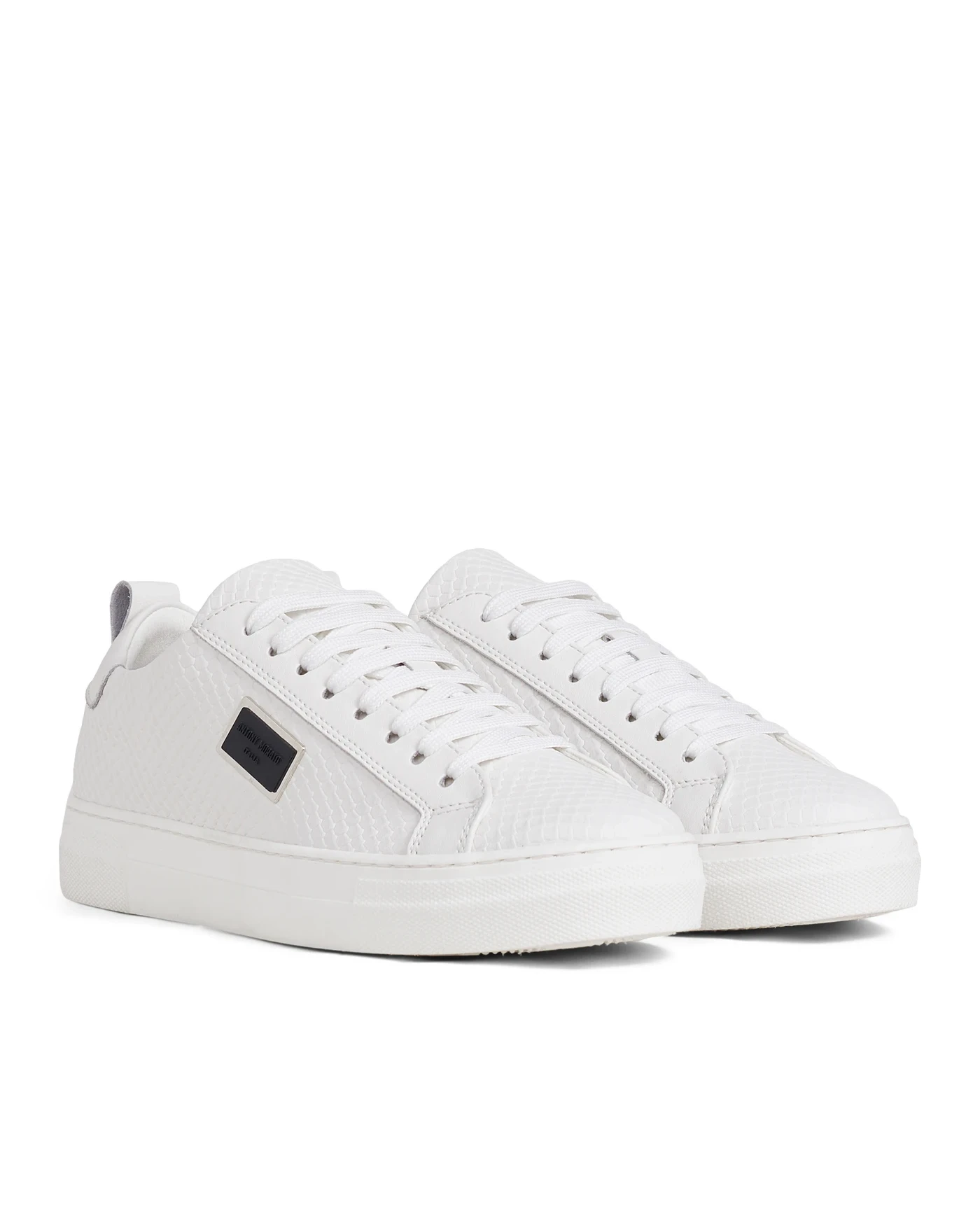 White leather sneakers prepared for an e-commerce catalog