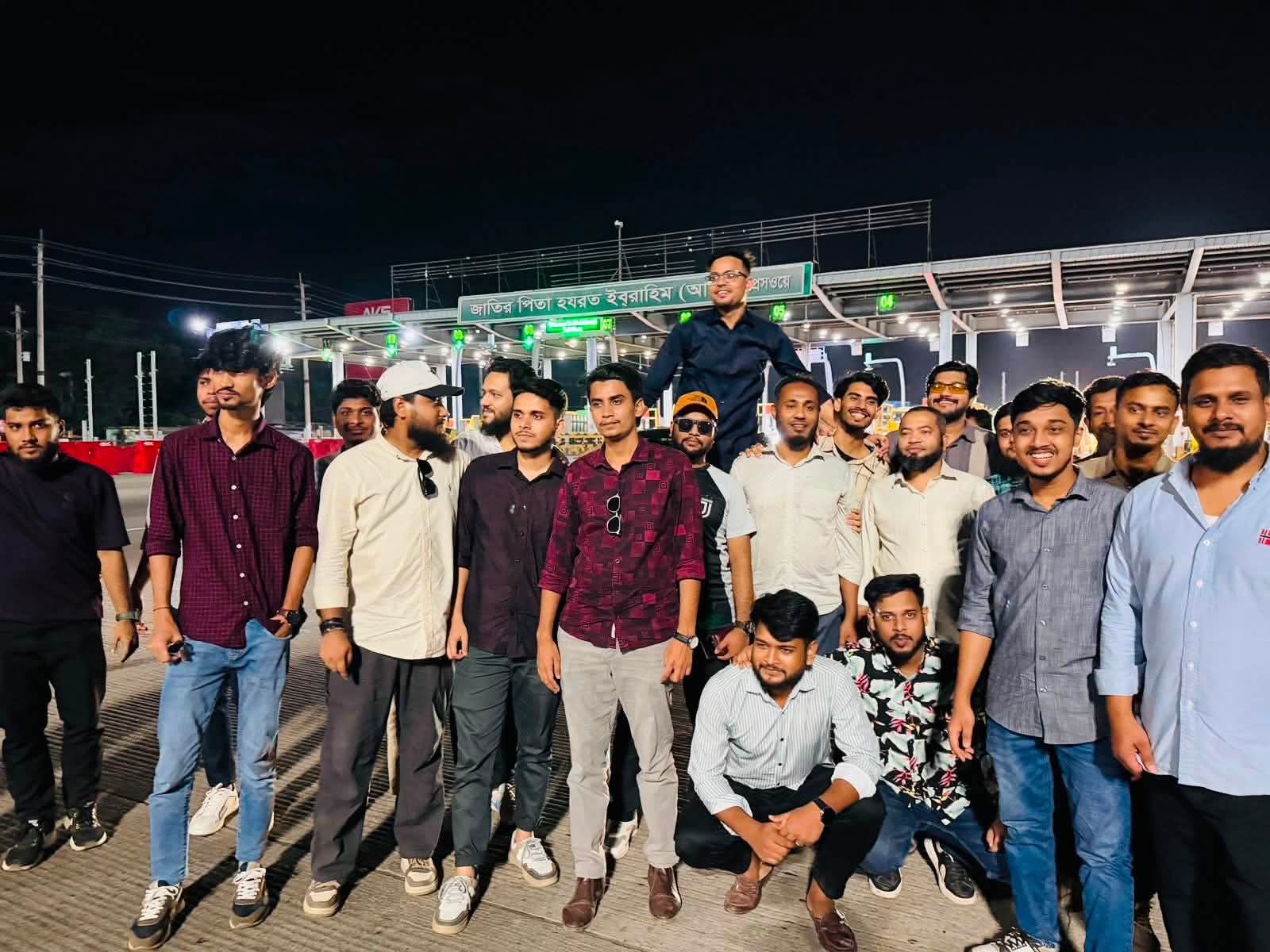 Studio Click House team members posing on the Padma bridge access road