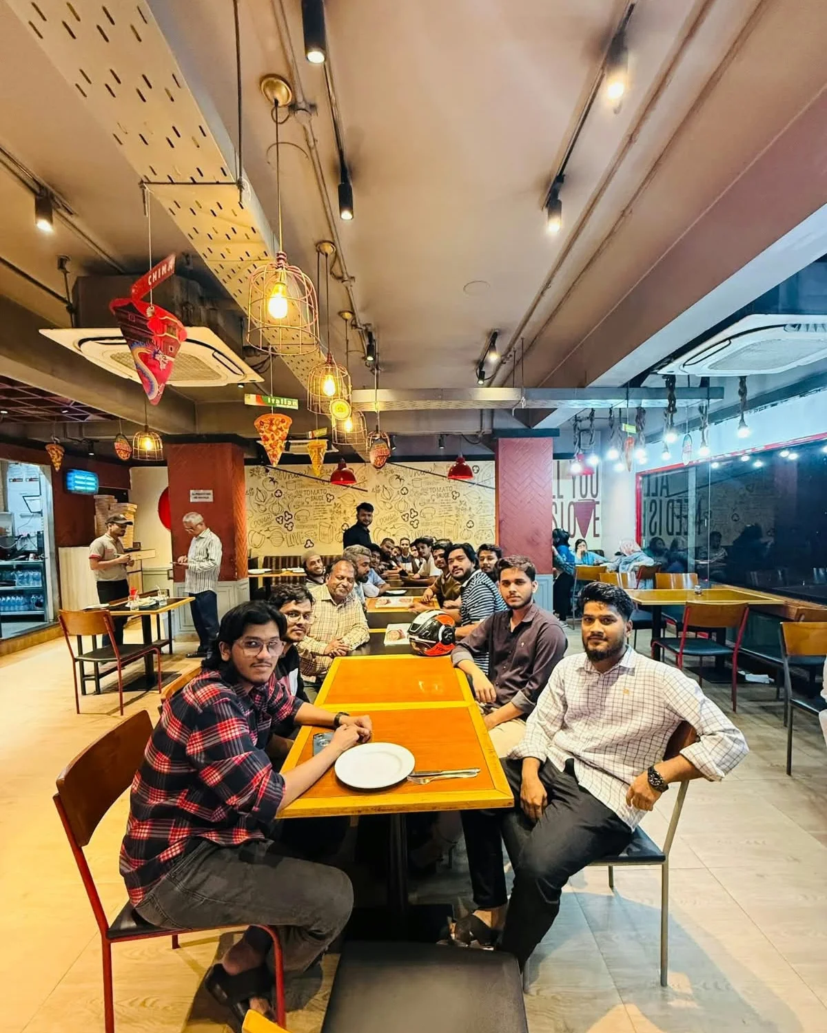 Studio Click House creative team gathered together enjoying pizza party