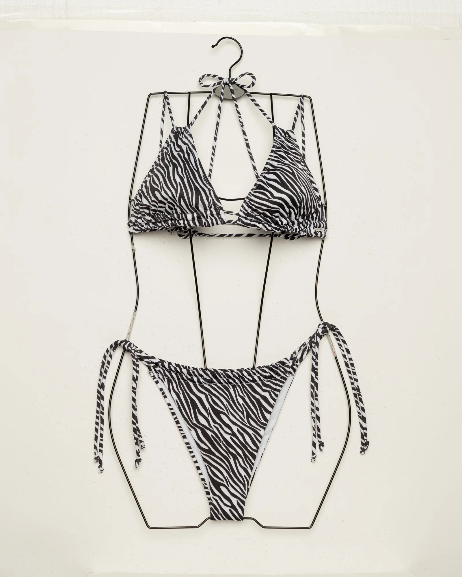Swimwear bikini on physical mannequin before invisible ghost mannequin editing