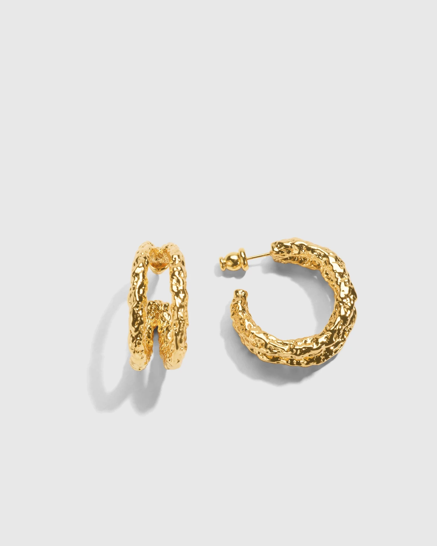 Pair of sculptural gold earrings with a polished finish
