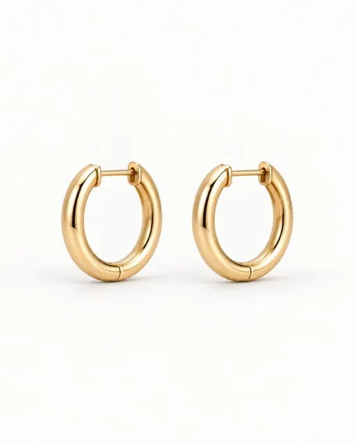 Polished gold hoop earrings studio packshot