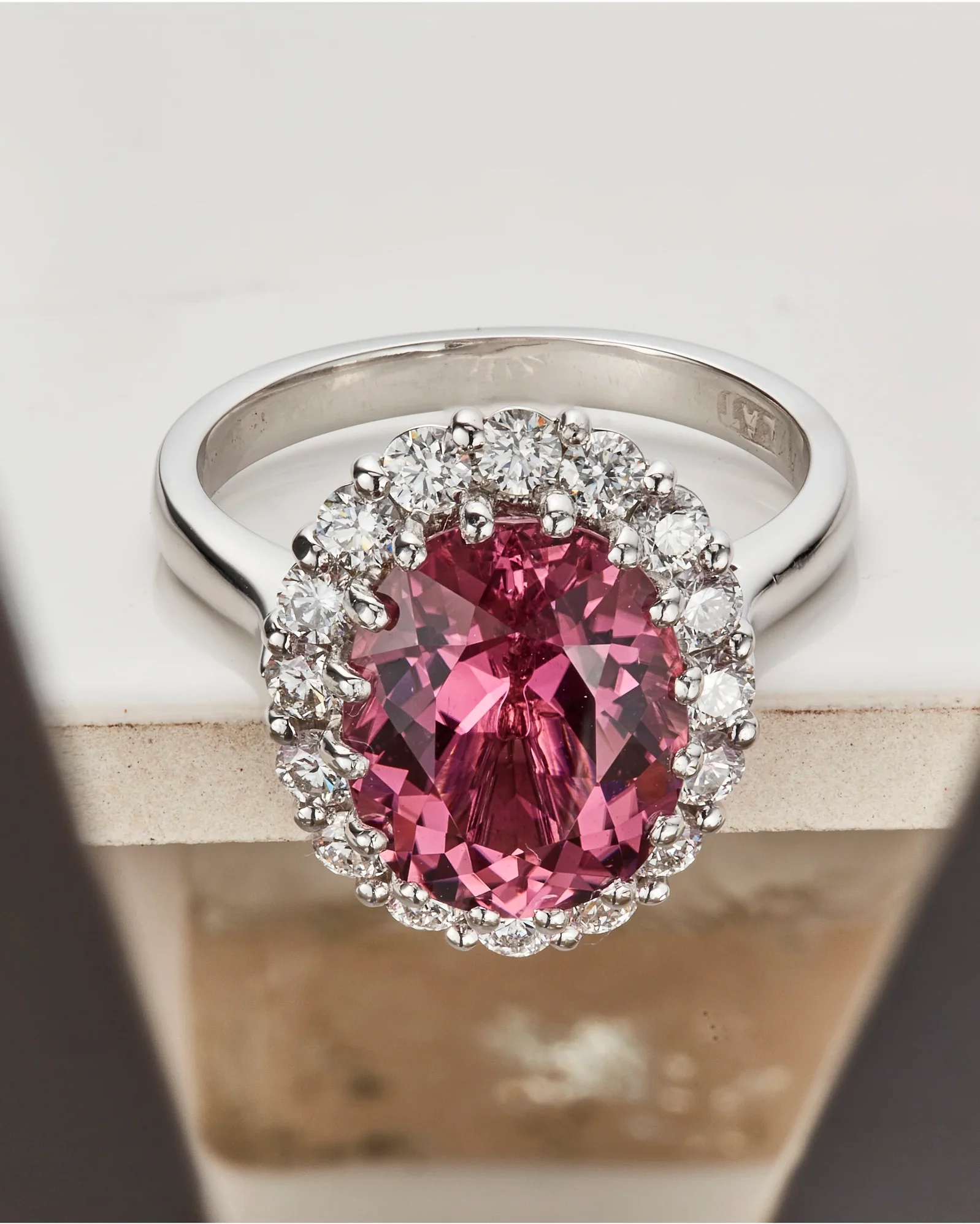 Pink sapphire halo ring before high-end jewelry retouching